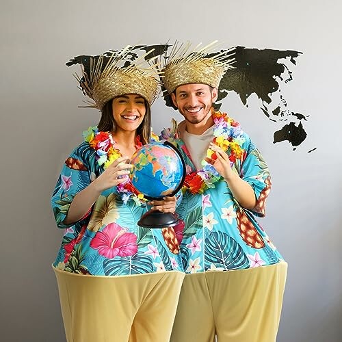 Couple in Hawaiian costumes holding a globe with world map backdrop.